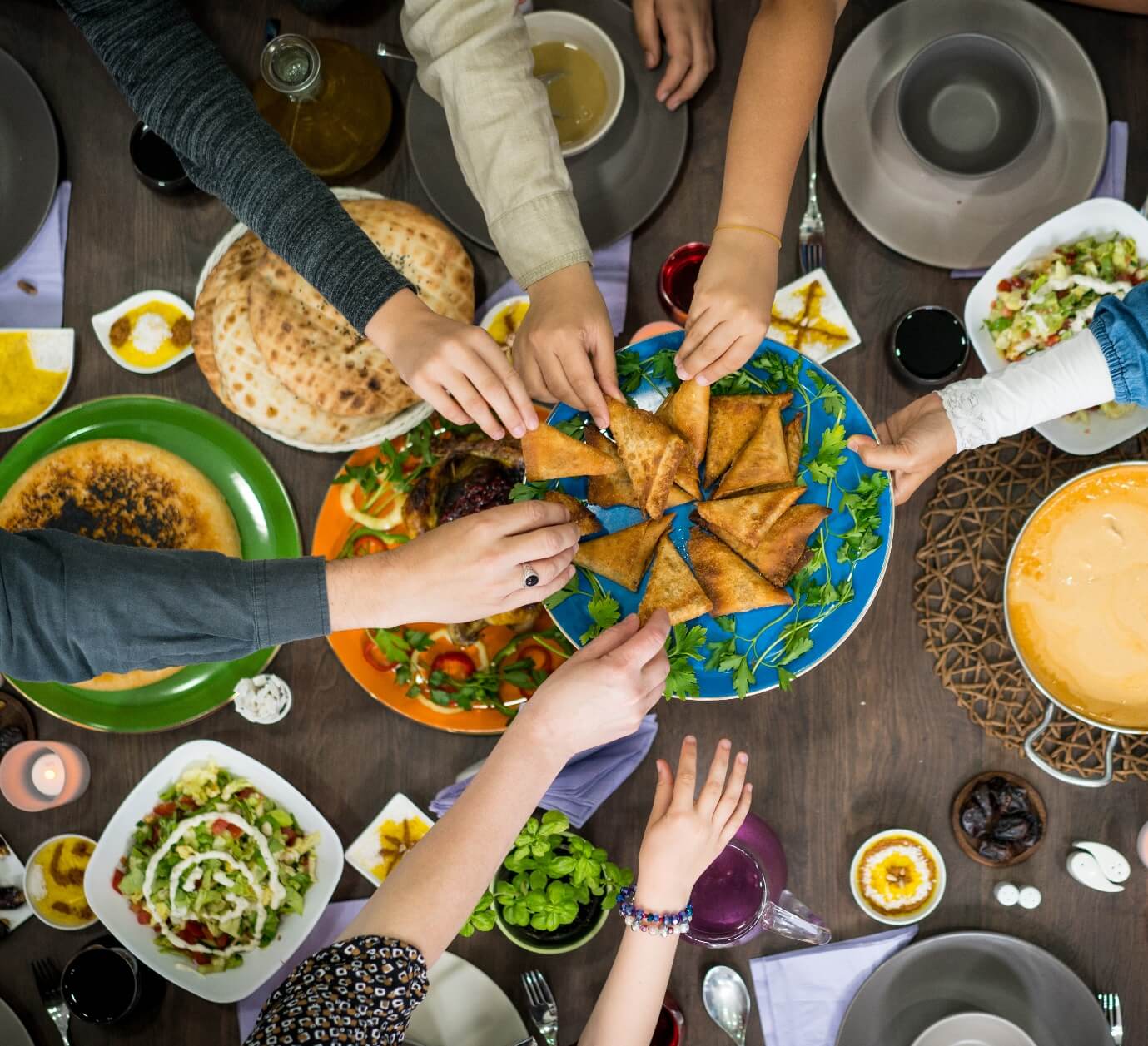 Table of enjoying arab food with family and friends top view